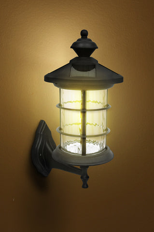 Classy Caps Black Aluminum Hampton Solar Lamp lit on wall mount 