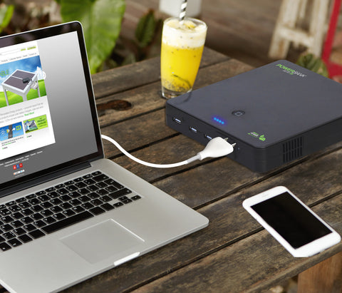 Nature Power - Power Bank Elite 25 Portable Battery Charger powering a laptop on a work desk