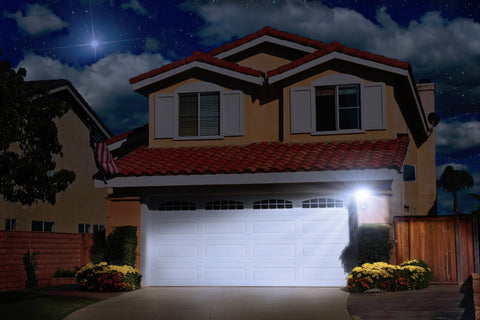 Nature Power COB Motion Activated Solar Security Light illuminating a home_s driveway