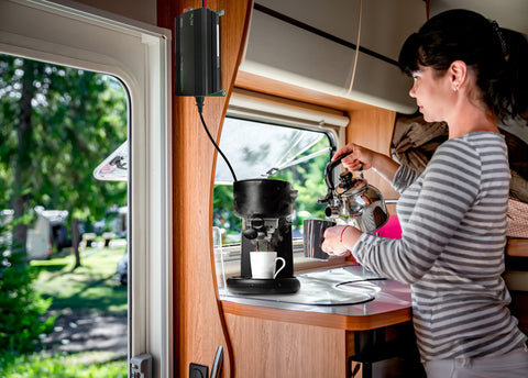 Woman pouring coffee in her RV - Coffee Maker is powered by Nature Power 2000 watts Sine Wave Inverter